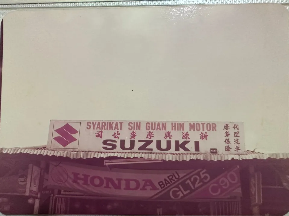 Historic SGH shopfront with Suzuki signage.